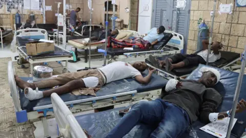 Reuters Injured African migrants lie on hospital beds after a reported US strike on a detention centre in Saada, northern Yemen, on 28 April 2025
