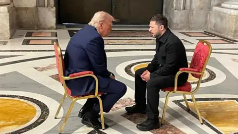 EPA Donald Trump and Zelensky sitting talking face to face at the Vatican.